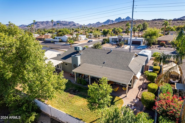 birds eye view of property with a mountain view