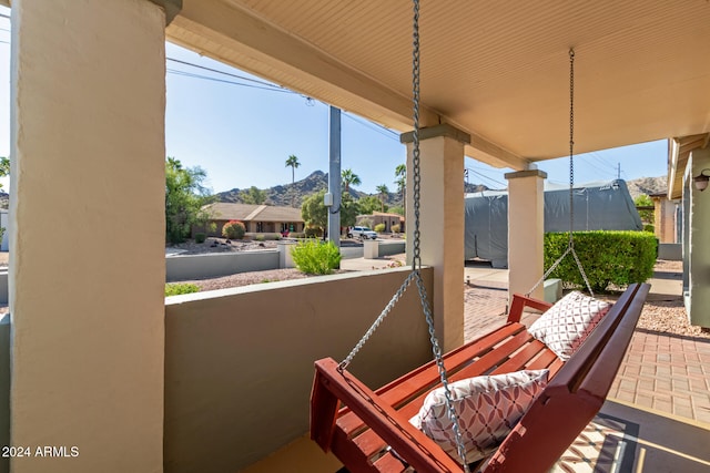 view of patio with a mountain view and a trampoline