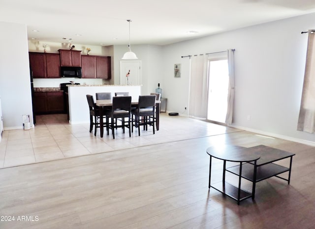 30111 N Oak Dr, Florence, AZ 85132 - dining space featuring baseboards and light wood-type flooring