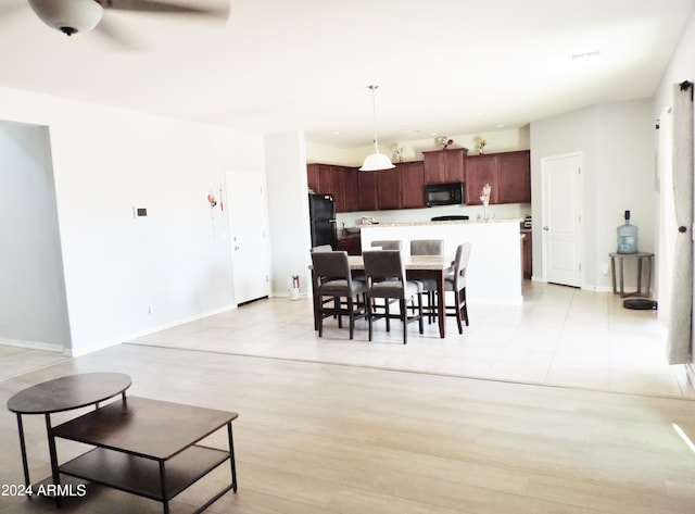 30111 N Oak Dr, Florence, AZ 85132 - dining space with baseboards, light wood-style floors, and a ceiling fan