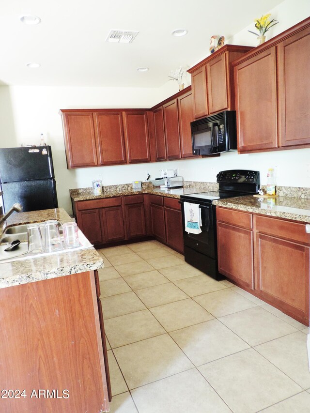 30111 N Oak Dr, Florence, AZ 85132 - kitchen featuring recessed lighting, light tile patterned floors, light stone counters, visible vents, and black appliances
