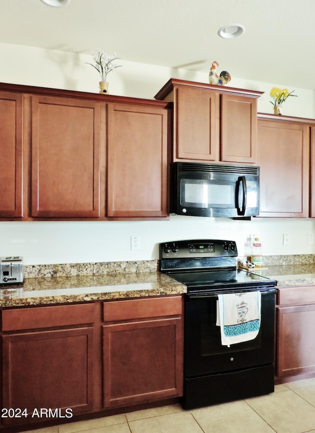 30111 N Oak Dr, Florence, AZ 85132 - kitchen with light tile patterned flooring, black appliances, and light stone counters