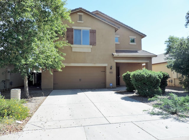 30111 N Oak Dr, Florence, AZ 85132 - traditional-style home with driveway, stucco siding, a tile roof, and an attached garage
