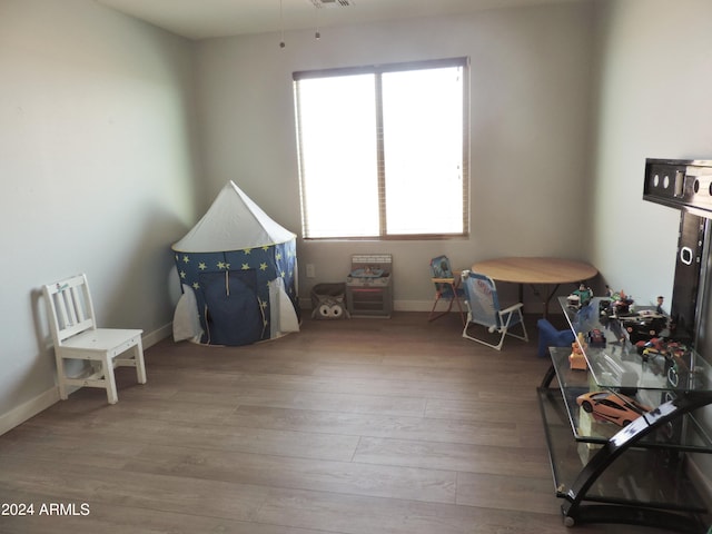 30111 N Oak Dr, Florence, AZ 85132 - rec room with baseboards, visible vents, and wood finished floors