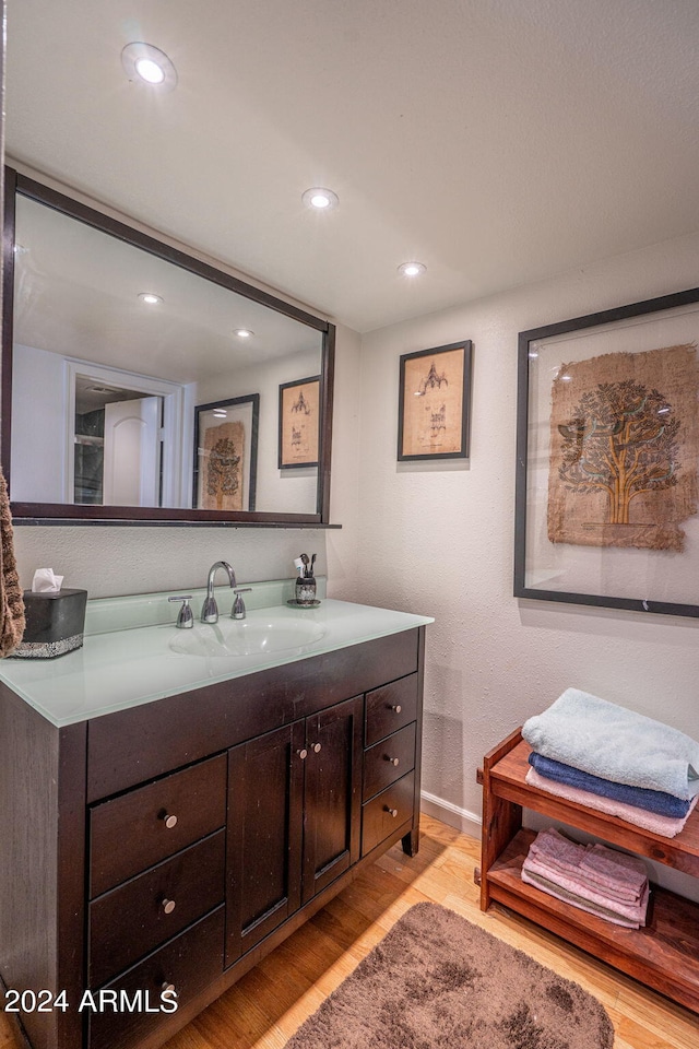 bathroom featuring vanity and hardwood / wood-style floors