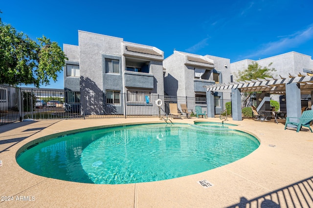 view of swimming pool featuring a patio area and a pergola