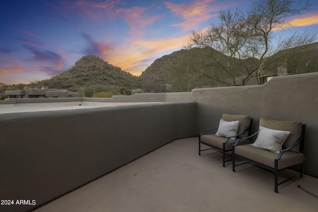 patio terrace at dusk with a mountain view