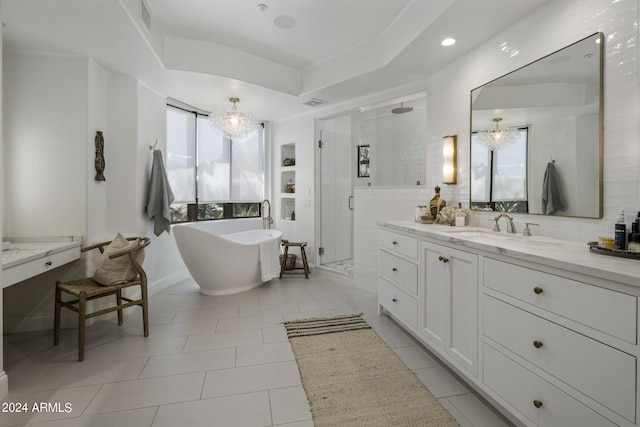 bathroom with plus walk in shower, tile patterned flooring, and vanity