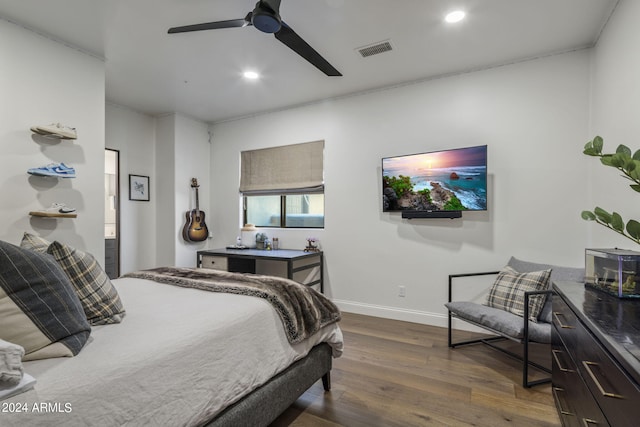 bedroom featuring ceiling fan and dark wood-type flooring