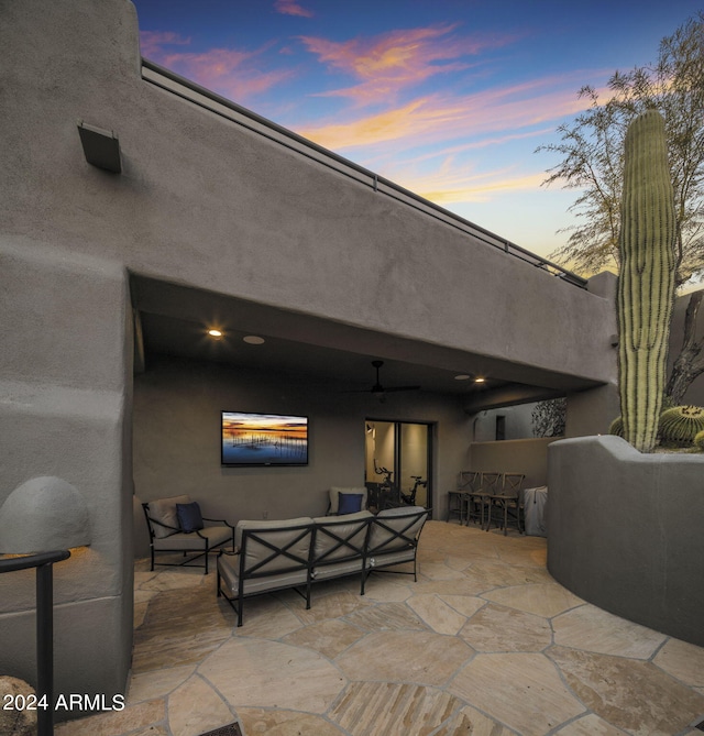 view of patio featuring an outdoor bar, ceiling fan, and an outdoor hangout area