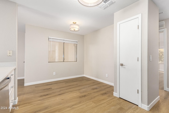 spare room featuring light wood-type flooring