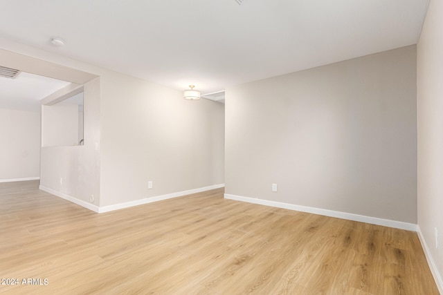 spare room with light hardwood / wood-style floors