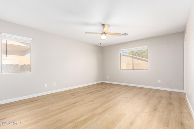 unfurnished room with light hardwood / wood-style floors and ceiling fan