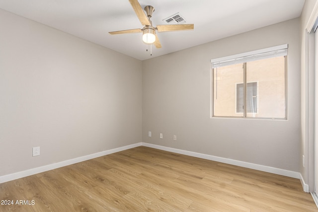 spare room with ceiling fan and light hardwood / wood-style flooring