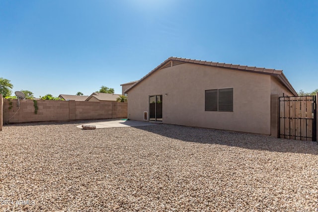 rear view of house featuring a patio area