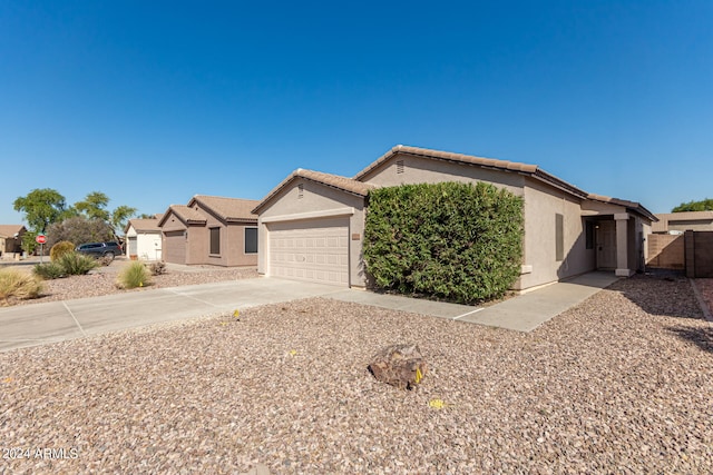 ranch-style home featuring a garage