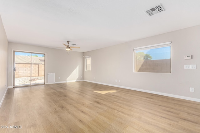 unfurnished room with ceiling fan and light hardwood / wood-style flooring