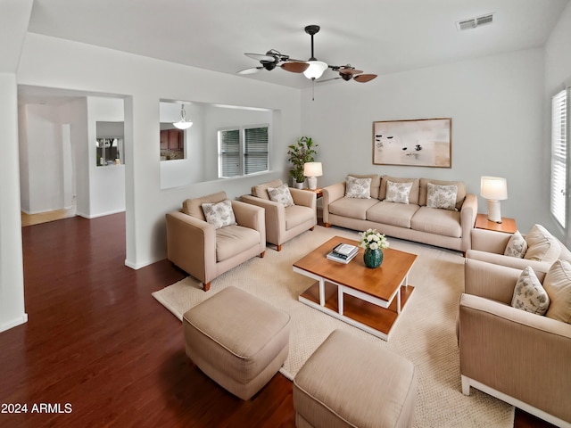 living room featuring ceiling fan and wood-type flooring