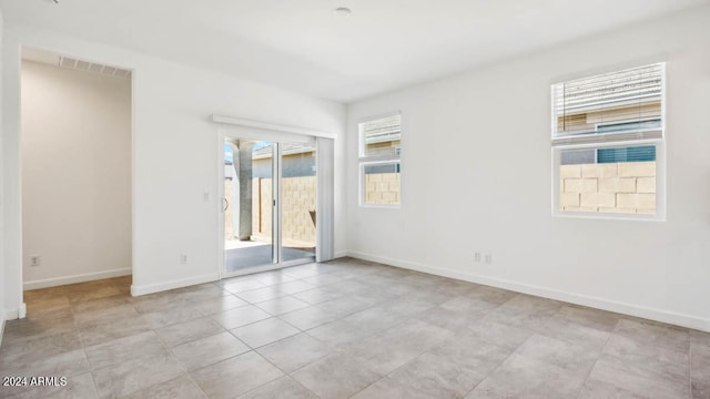 view of tiled spare room