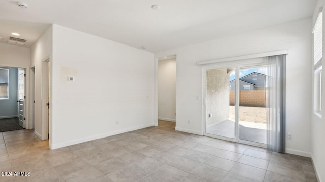 view of tiled spare room