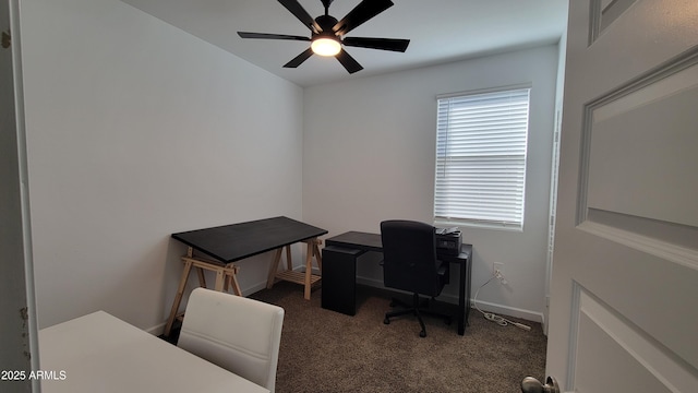 office with dark colored carpet and ceiling fan