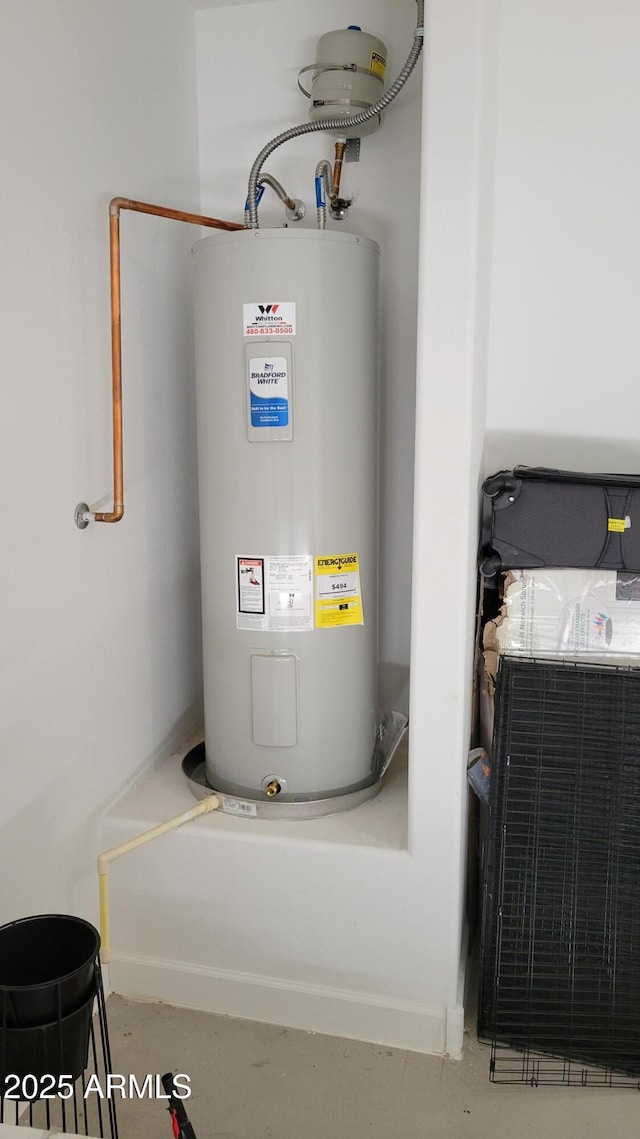 utility room with electric water heater