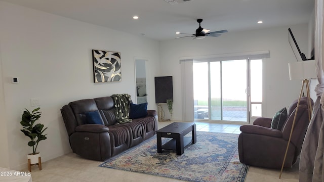 living room featuring light tile patterned floors and ceiling fan