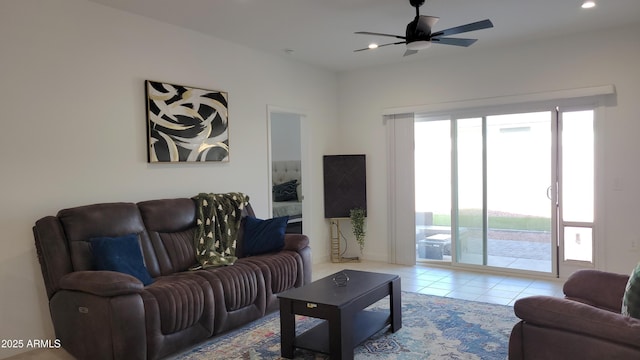 living room featuring light tile patterned floors and ceiling fan