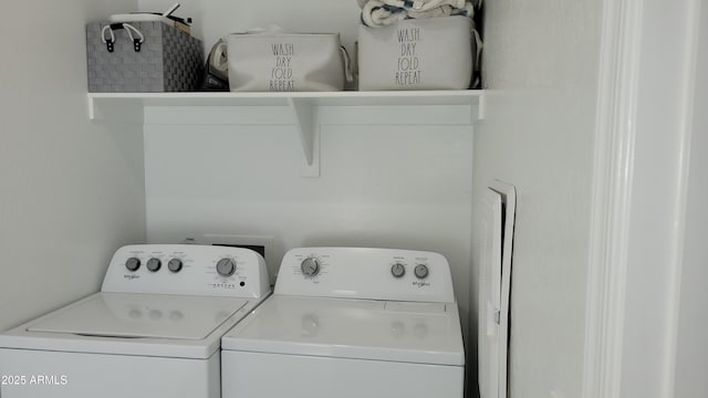 clothes washing area with washer and clothes dryer