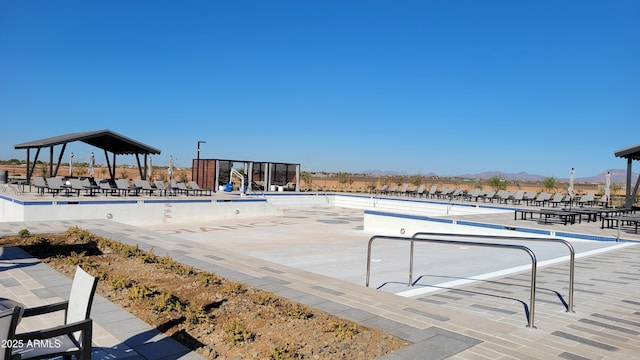 view of swimming pool featuring a mountain view