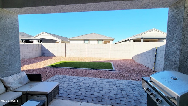 view of patio featuring a grill