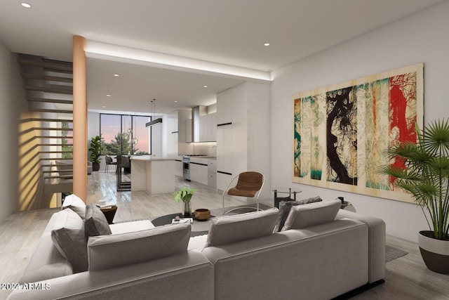 living room with light wood-type flooring and a wall of windows