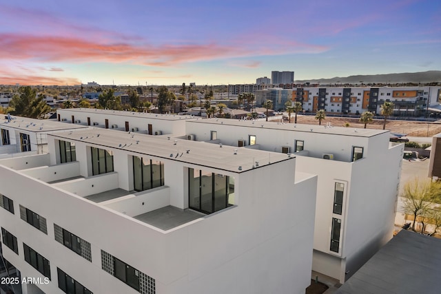 view of outdoor building at dusk