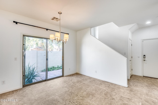 interior space featuring a chandelier