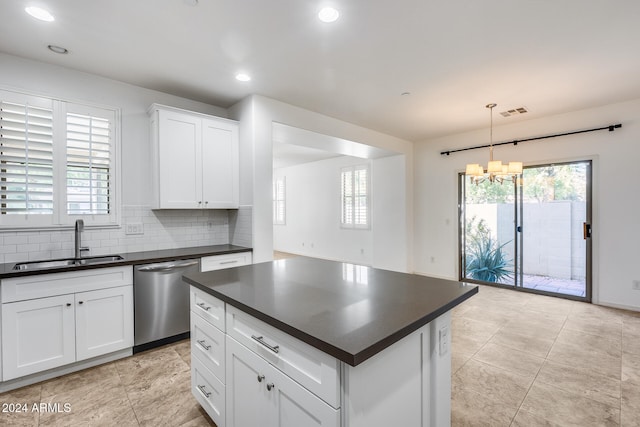 kitchen with dishwasher, white cabinetry, pendant lighting, and plenty of natural light