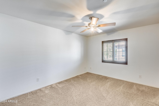 empty room with carpet floors and ceiling fan