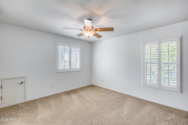 empty room with carpet floors and ceiling fan