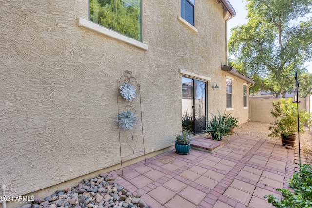 rear view of property featuring a patio area