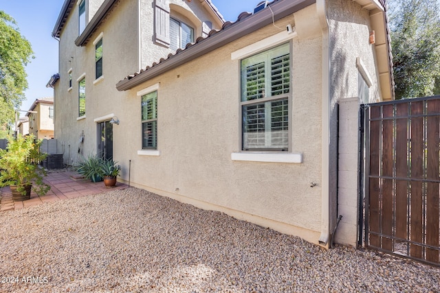 view of side of property with a patio