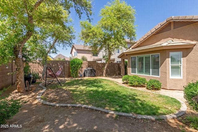 view of yard with a fenced backyard