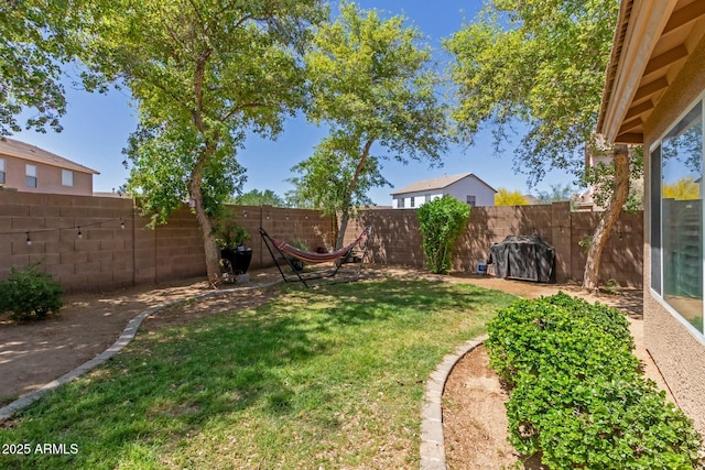 view of yard featuring a fenced backyard