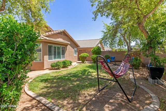 view of yard with a fenced backyard