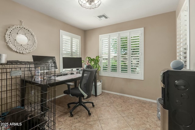 office area with washer / dryer, baseboards, tile patterned flooring, and visible vents