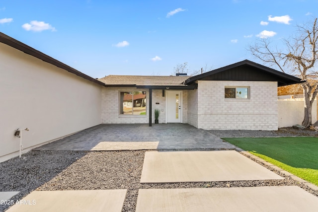 view of front of house with a patio area