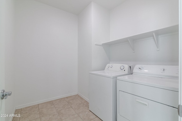 4702 S 109th Ave, Tolleson, AZ 85353 - laundry room featuring light tile patterned flooring, washing machine and clothes dryer, baseboards, and laundry area