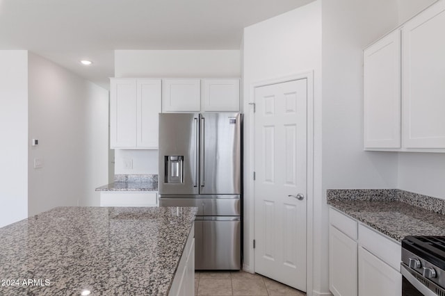 4702 S 109th Ave, Tolleson, AZ 85353 - kitchen with white cabinets, stone countertops, and stainless steel appliances
