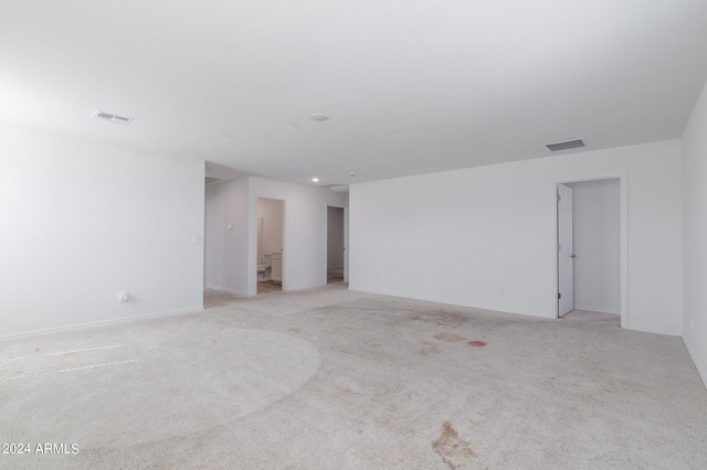 4702 S 109th Ave, Tolleson, AZ 85353 - spare room with baseboards, visible vents, and light colored carpet