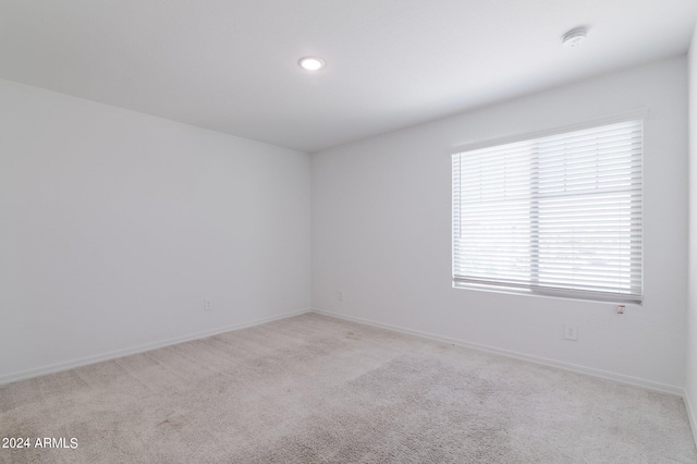 4702 S 109th Ave, Tolleson, AZ 85353 - spare room featuring recessed lighting, light carpet, and baseboards