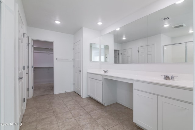 4702 S 109th Ave, Tolleson, AZ 85353 - full bathroom featuring a walk in closet, visible vents, a sink, and double vanity