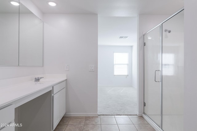 4702 S 109th Ave, Tolleson, AZ 85353 - bathroom with tile patterned floors, visible vents, vanity, baseboards, and a stall shower